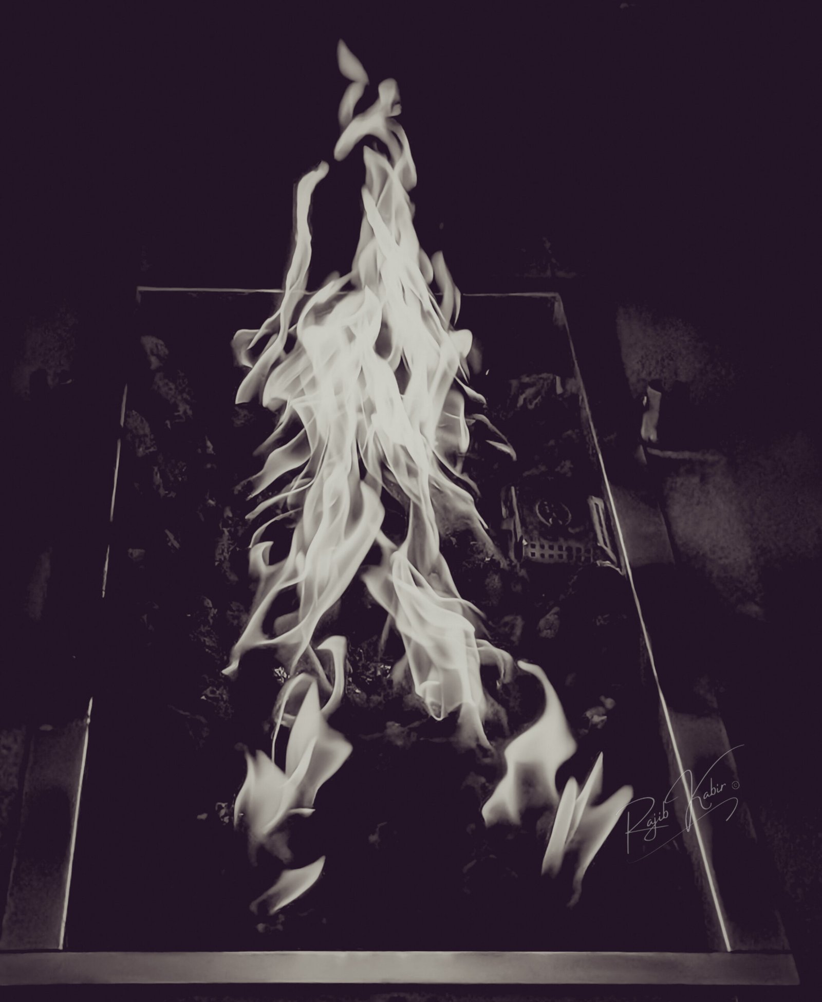 Dancing flames captured in an artistic black-and-white composition.